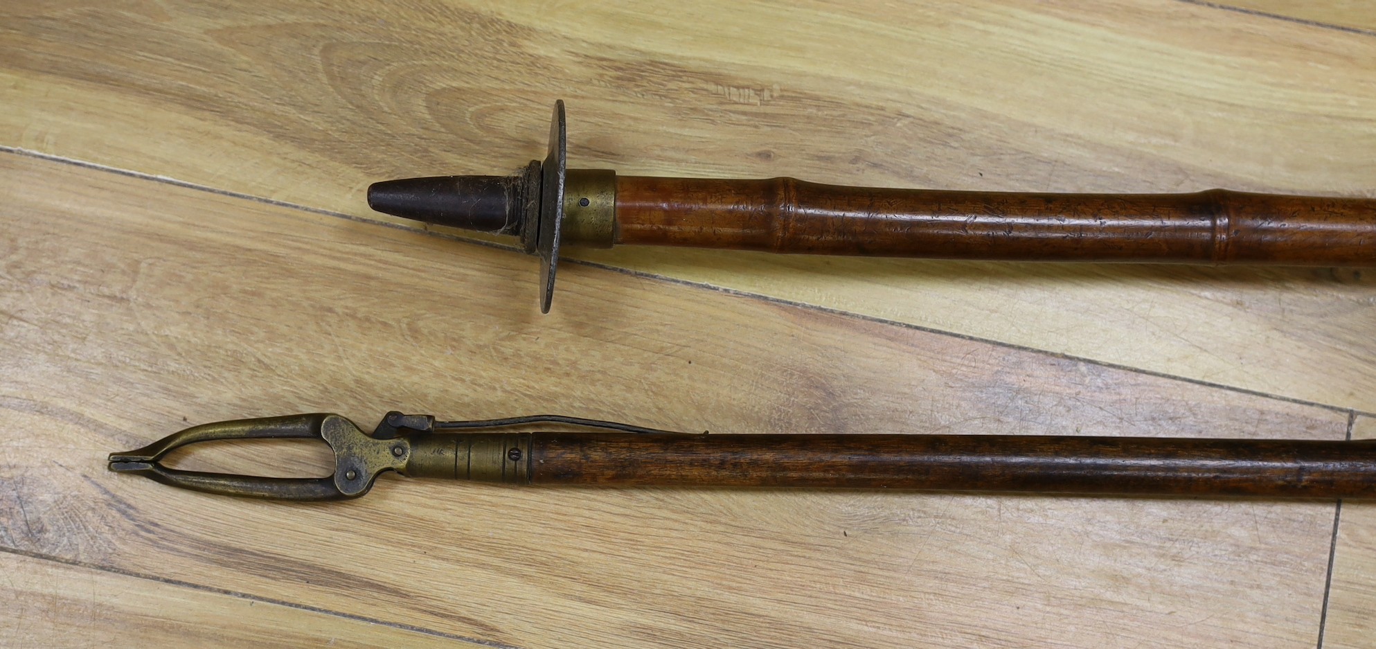A French bamboo shooting stick and a Victorian library book grabber, 122.5cm